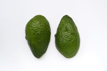 Halved ripe avocado isolated on a white background. View from above