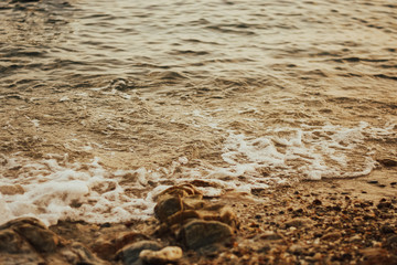 Soft wave of blue ocean on sandy beach.