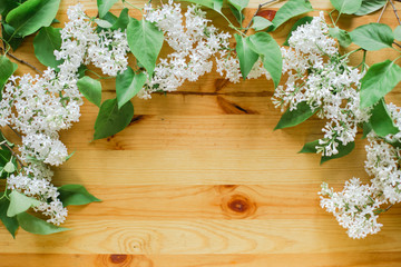 flowers laid out on a wooden background. there is a place for things