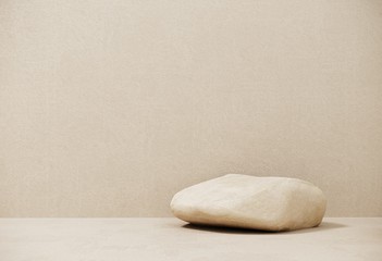 Premium podium made of paper on pastel background with plant branches,leaves,pebbles and natural stones.Mock up for the exhibitions,presentation of products, therapy, relaxation and health -3d render.