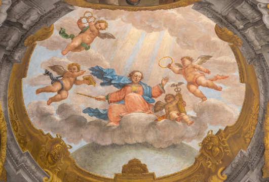 FERRARA, ITALY - JANUARY 30, 2020: The fresco of Madonna among the angels from ceiling of church Basilica di San Giorgio fuori le mura by Francesco Ferrari 18. cent.