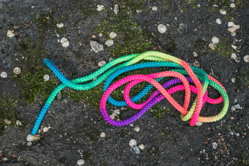 Children's sports tape elastic band for physical education is on the ground. Multi-colored texture.