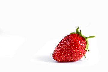 Strawberry. Beautiful sweet berry of red color on a white background. Place for text. High-quality photos for web sites of banners and magazines.