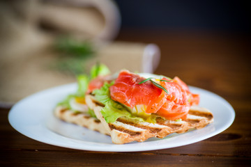 fried bread toast with salad leaves and salted red fish