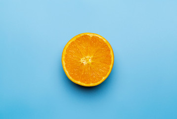 Slice of orange on blue background