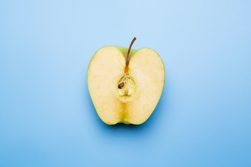 Sliced apple on a blue background