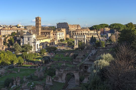 Ruins of Roman forum with Colosseum on background , Rome, Italy