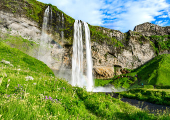 The Seljalandsfoss waterfall in south Iceland during a sunset