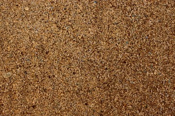 A beautiful background pattern of sand particles closeup shot (macro)