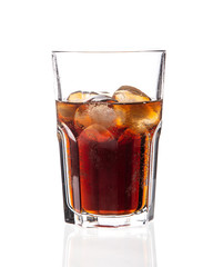 Cola with ice on a white background in a glass glass