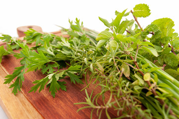 fresh herbs on a wooden board