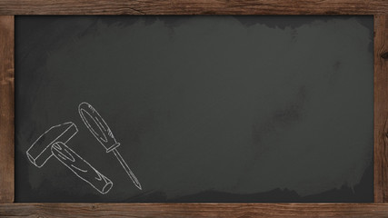 blackboard with a hammer and a screwdriver