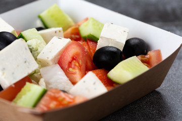 .Greek salad of fresh vegetables with tomato, cucumber, olives and cheese. salad dressed with olive oil