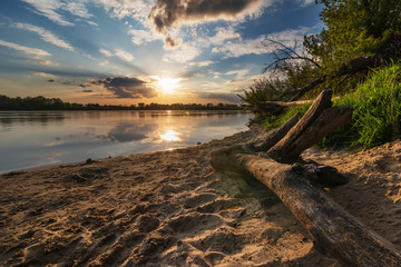 Naklejka premium Beautiful evening on the river at sunset
