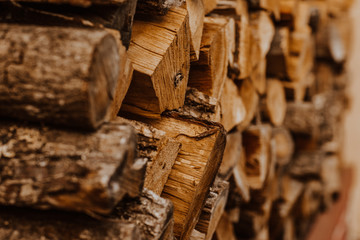 A bunch of wooden hacked firewood laying outside