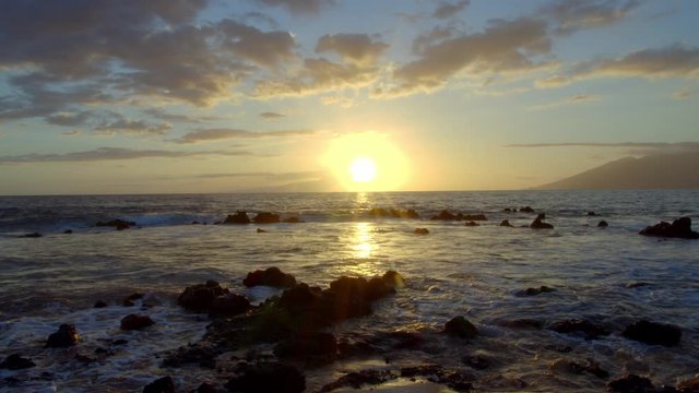 Time lapse of sunset on beach in Maui
