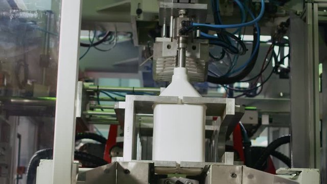 Filling plastic bottle on the conveyor. Clip. High technology Plastic bottle manufacturing industrial, Raw material plastic bottle production, precision plastic bottle blow method