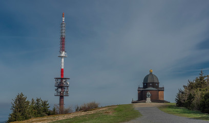 Obraz premium Brown wooden old chapel and transmitter on Radhost hill in Beskydy mountains