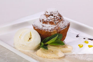 Tasty hot muffin with ice cream