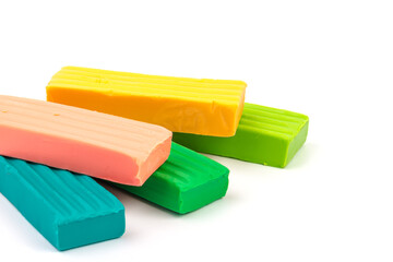 Group of colorful plasticine isolated on white background