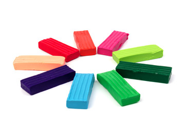 Group of colorful plasticine isolated on white background