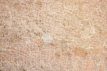 Hand carved old stone as background, pattern or texture