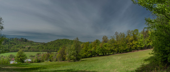 Green spring meadows near Dolni Becva village in Beskydy mountains