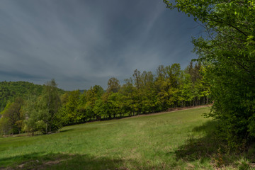 Green spring meadows near Dolni Becva village in Beskydy mountains