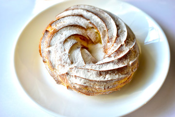 Ruffin custard ring with cottage cheese cream on a plate