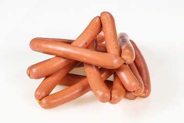 Tasty meat sausages over white background