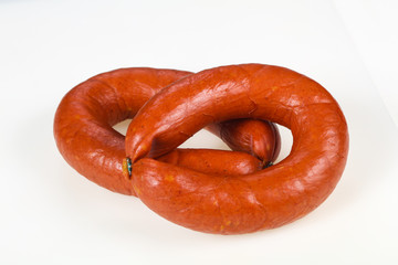 Tasty meat sausages over white background