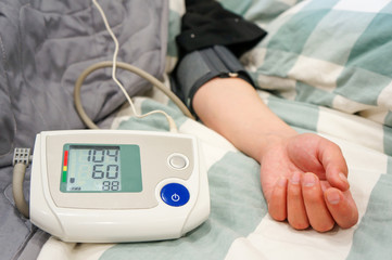Woman takes care of health with a focal point and blood pressure monitor