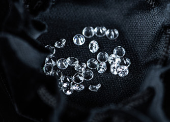 Small Diamonds on dark background (close up shot; selective focus)