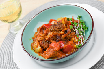 Beef balls with vegetables and tomato sauce