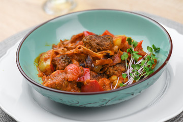Beef balls with vegetables and tomato sauce