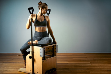combo wunda pilates chair woman instructor fitness yoga gym exercise. Copy space. sports banner - Powered by Adobe