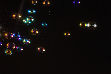 Soap bubbles isolated on a black background. Copy space.