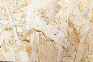 chipboard close-up texture with small pieces of wood