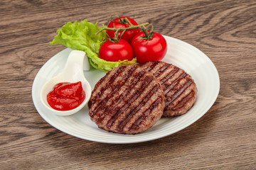 Grilled burger cutlet with sauce