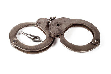 police handcuffs on a white background, isolate, close-up
