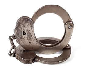 police handcuffs on a white background, isolate, close-up