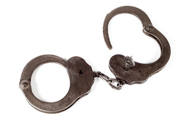 police handcuffs on a white background, isolate, close-up