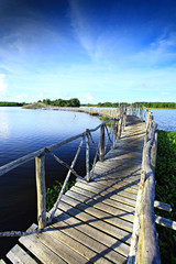 Fototapeta premium Long wooden walkway connecting to island at Nong Yai Development Project Chumphon Thailand 