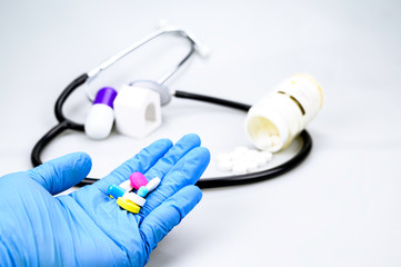 A variety of medicines in the hands of doctors