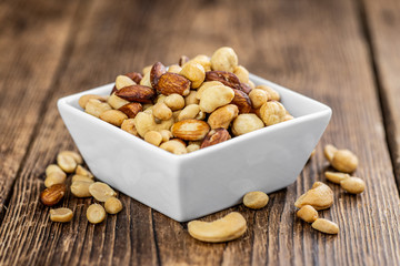 Portion of roasted nuts (close up; selective focus)