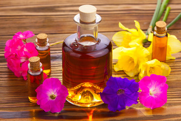 Obraz na płótnie Canvas petunia essential oil in beautiful bottle on table