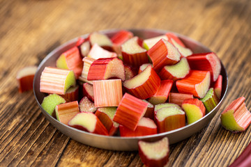 Chopped Rhubarb on an old wooden table (close up shot)