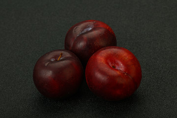 Ripe sweet plum fruit heap