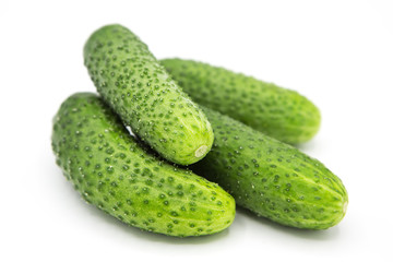 fresh organic cucumbers isolated on white background