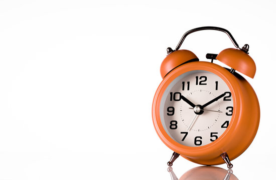 Orange Alarm Clock On White Background